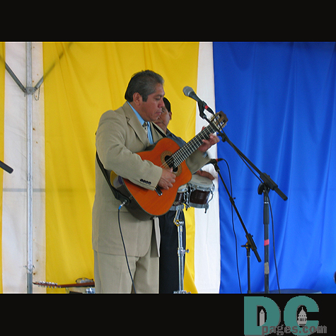 Musician focusing on his guitar.