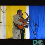 Musician focusing on his guitar.