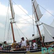 Also an educational festival, this woman is teaching young children the ways and means to man a boat.  The children enjoy the simulation, and gain interesting knowledge in the process.