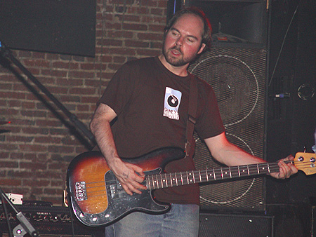 PtL's bass player rocks out to tunes from their most recent album, Achille's Heel