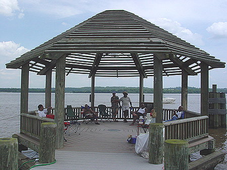 These friendly people are having a little cook-out before they go over to the festival.