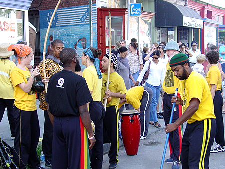 Preparing for the show, these performers get their drums and strange string instruments.