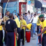Preparing for the show, these performers get their drums and strange string instruments.