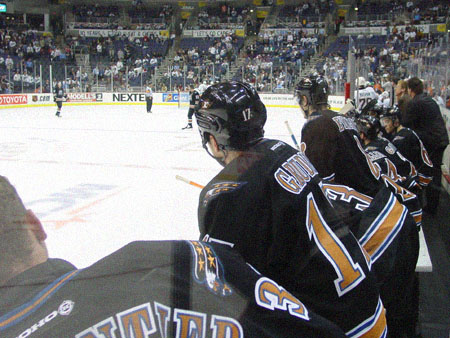 John Gruden and the rest of the Caps look on as the team continued to outplay the visiting Islanders.