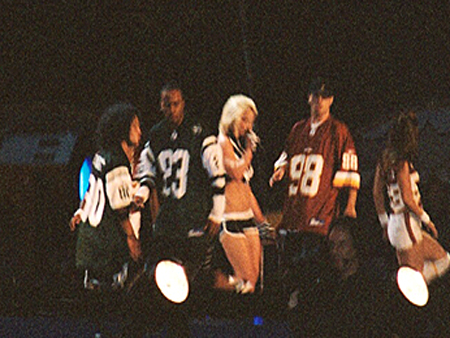 Britney was accompied by several dancers wearing Washington Redskins and New York Jets jerseys.