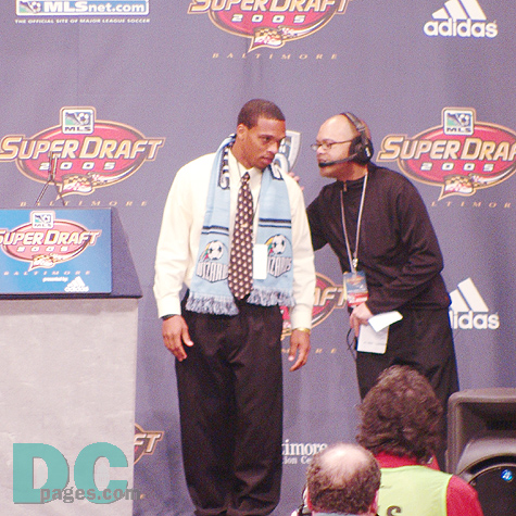 Scott Sealy, chosen 11th overall by the Kansas City Wizards pauses to receive a quick congratulatory note...