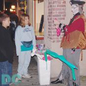 A pirate transforms balloons into scary shapes for the kids.
