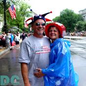 A husband and wife wait for the parade to start.