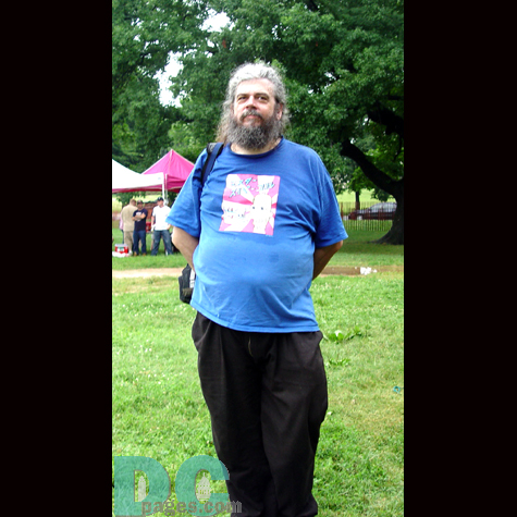 A man waits for the concert to begin.