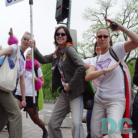 A group of marchers from the Feminist Majority wear F on their t-shirts like the S on Superman.