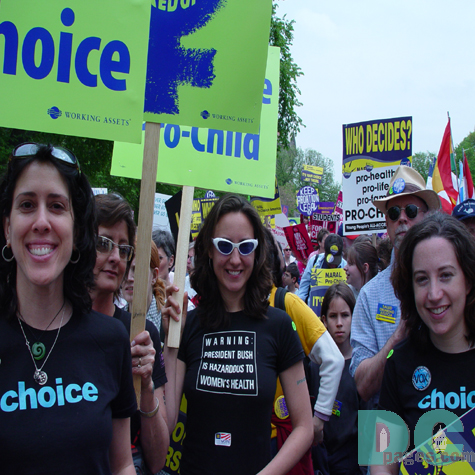 Two marchers make a simple statement: CHOICE while another wears a t-shirt that states WARNING: PRESIDENT BUSH IS HAZARDOUS TO WOMENS HEALTH.