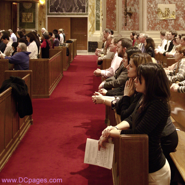 Young Catholic adults in prayer.