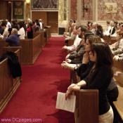 Young Catholic adults in prayer.