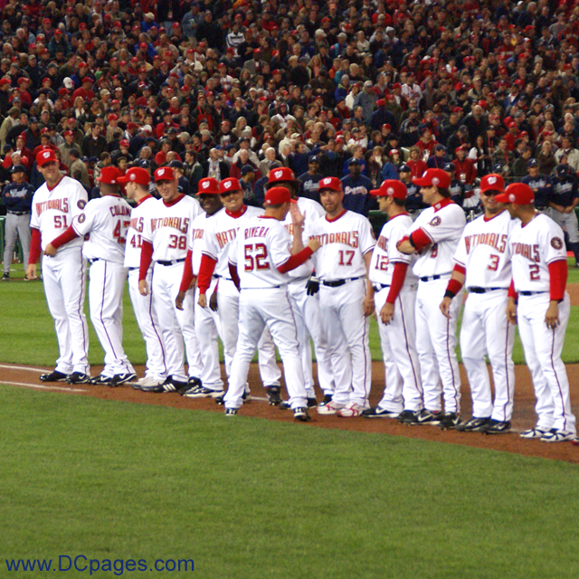 Washington Nationals relief pitcher Saul Rivera greets his teammates.