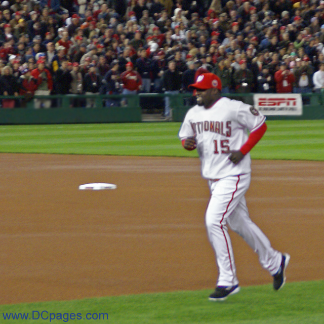 Washington Nationals starting SS Cristian Guzman trots onto the field. Guzman hit lead off for the home team.