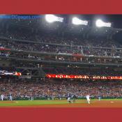 Braves pitcher Tim Hudson tries to pickoff Washington Nationals Cristian Guzman but ends up committing an error.