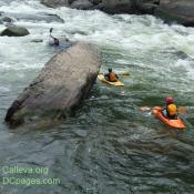 A rough current can't stop these kayakers 