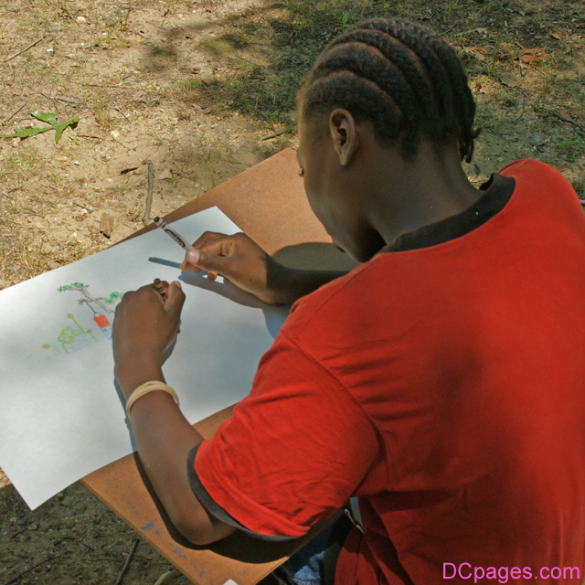 This girl is drawing a lantern for the contest