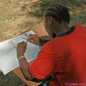 This girl is drawing a lantern for the contest