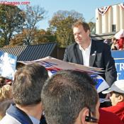 Passing out rally signs.