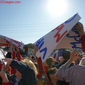 Passing out rally signs.