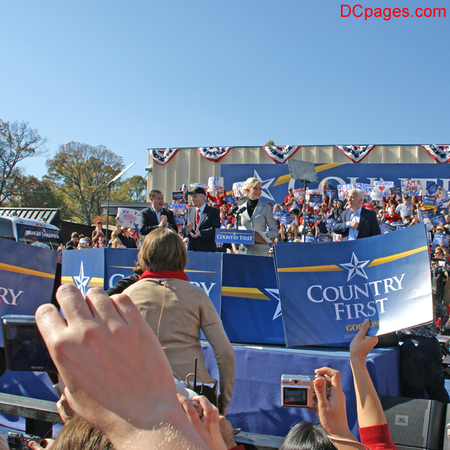The crowd chants, "John McCain, John McCain!"