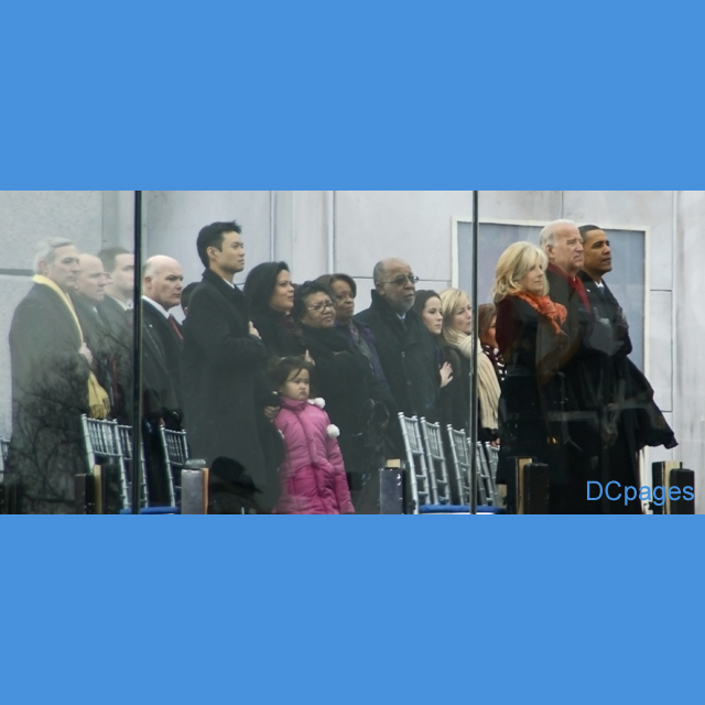 Obama and Biden Families stand as The Star Spangled Banner is sung