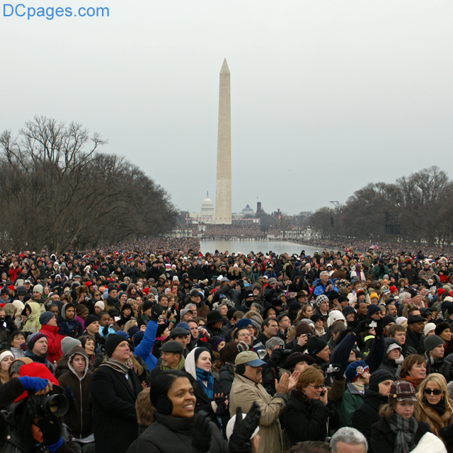 Adherents of newly elected President Obama applaude his speech