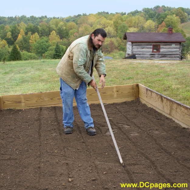 Karl Durst marks the seed bed lines. Karl has been a farmer all of his life. He manages Santa's Forest with pure West Virginia pride. "I work to relax and enjoy life." - Karl Durst
