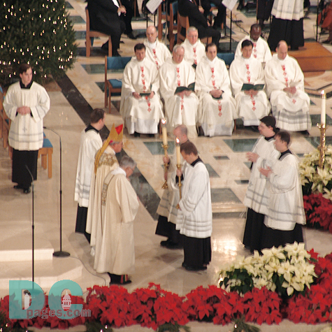 Alter Servers receive the blessing from the bishop before the Presentation of the Gifts.