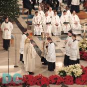 Alter Servers receive the blessing from the bishop before the Presentation of the Gifts.