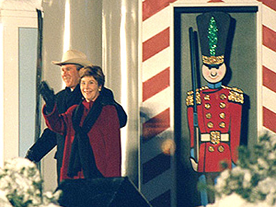 President George W. Bush and 1st Lady Laura Bush take the stage