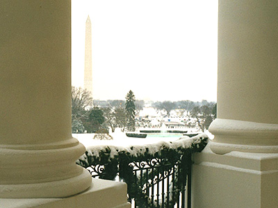 Through the pillars, a beautiful view of the Washington Monument 