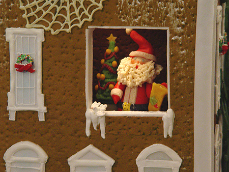 Santa Claus pays a visit to the gingerbread White House.