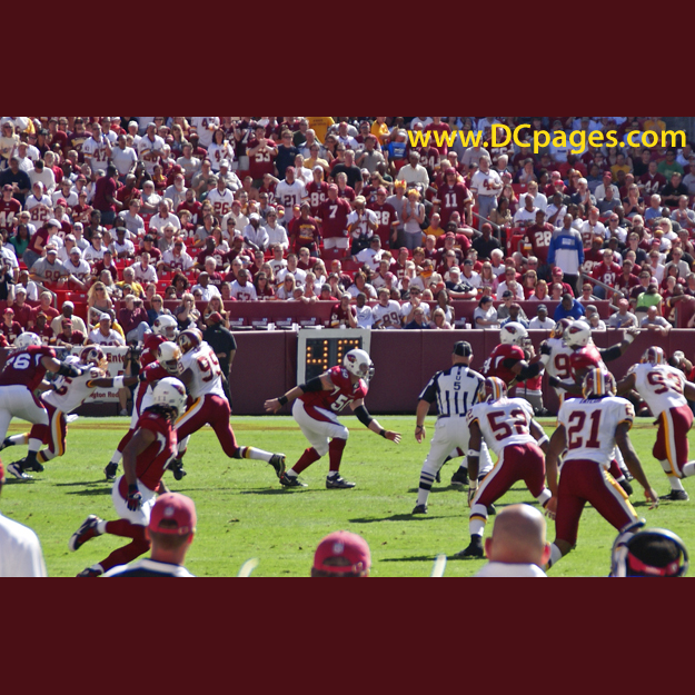 Kurt Warner (13) looks for an open receiver, but finds Redskin defenders swarming everywhere.