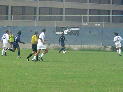 As Howard forwards bring the ball up the field, the Hoyas defense scrambles to stop them.