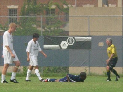 Red Card!! A Howard player goes down and the referee awards Howard a free kick because of the foul.