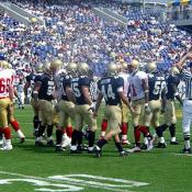 The Midshipmen get ready for a huddle before the next play.