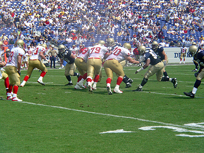 The Keydets and the Midshipmen scrammble for the lose ball.