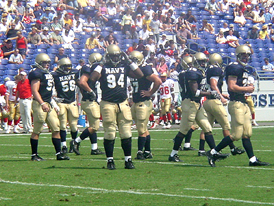 Steve Adair, #94, and the rest of the defensive line run off the field after stopping VMI from scoring.