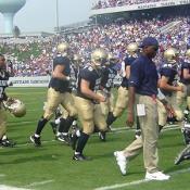 The Midshipmen hussle off the field for half-time.