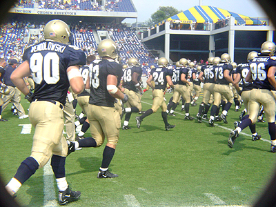 #90, Dan Wendolowski follows his teammates to the locker room after a very successful first half.