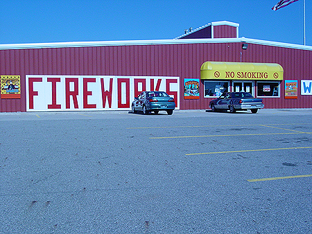 Notice the "NO SMOKING" sign at the entrance of the building