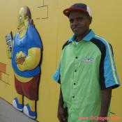 KWIK-E-MART employee hangs out with the comic book guy in front of the Bladensburg KWIK-E-MART. I really wanted his shirt. He would not sell it.