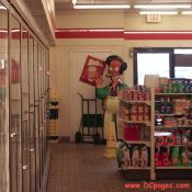 Indian-American owner, Apu Nahasapeemapetilon Jr. takes some time to wave before stocking his shelves.