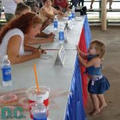 This little girl Reached up to the beauty contest judges and introduced herself.
