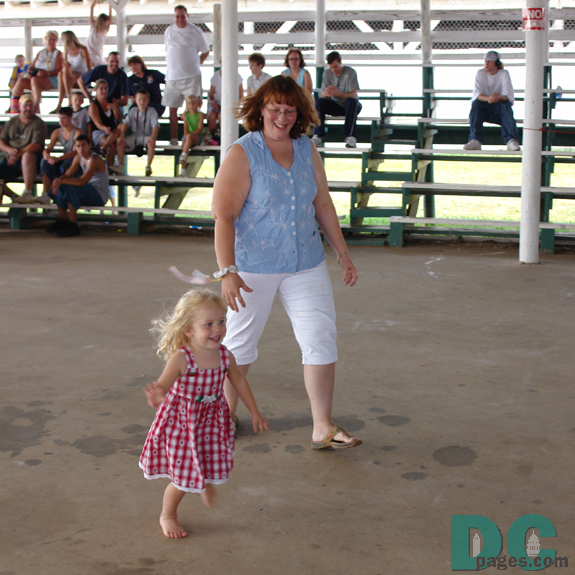 This little girl ran past her mother.