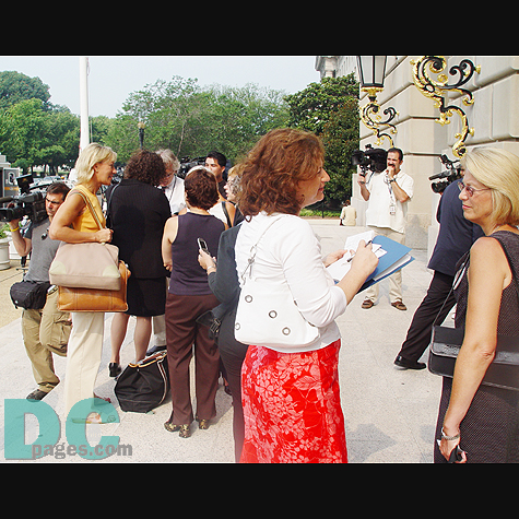 News reporters interview Family members of 9-11 victim.