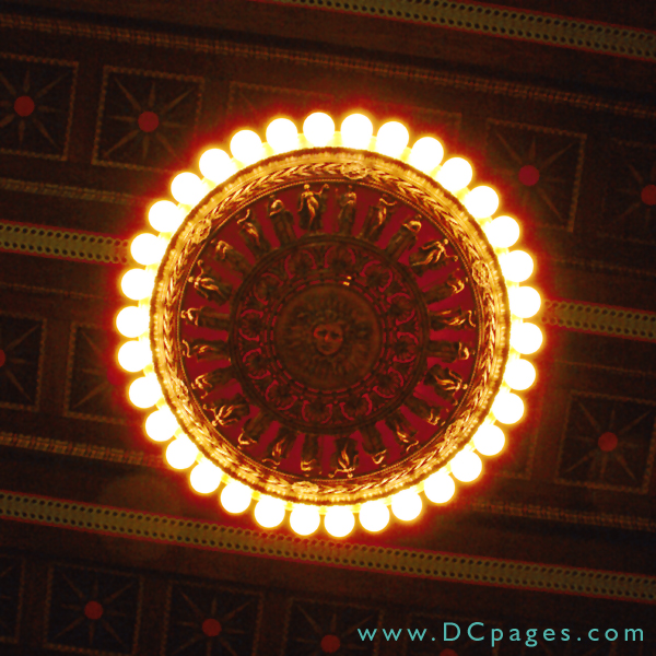 4 large solid bronze chandeliers light up the atrium. The alabaster bowls. On  the bowls there are Grecian figures surrounding the bowls.