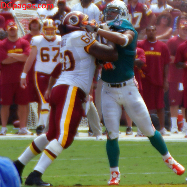 Washington Redskins Home Opener - Pro Bowler Chris Samuels stands up Defensive Player of the Year Jason Taylor.